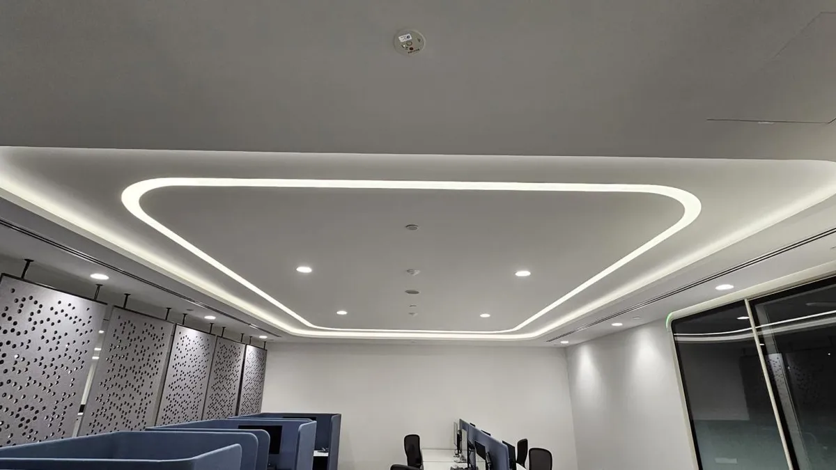 Triangular LED cove detail in a false ceiling above a meeting room in Singapore